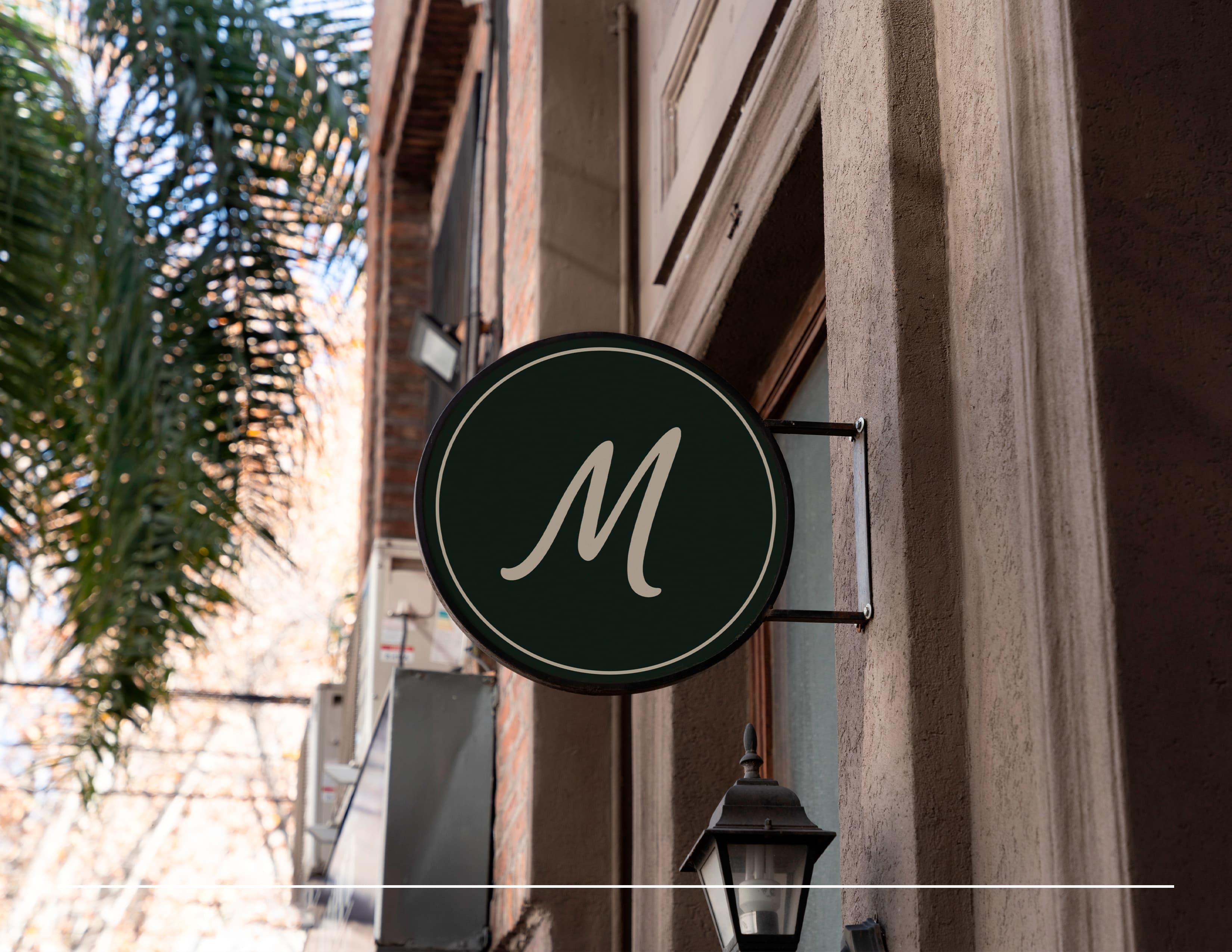 Round MAVIK monogram sign on a shopfront