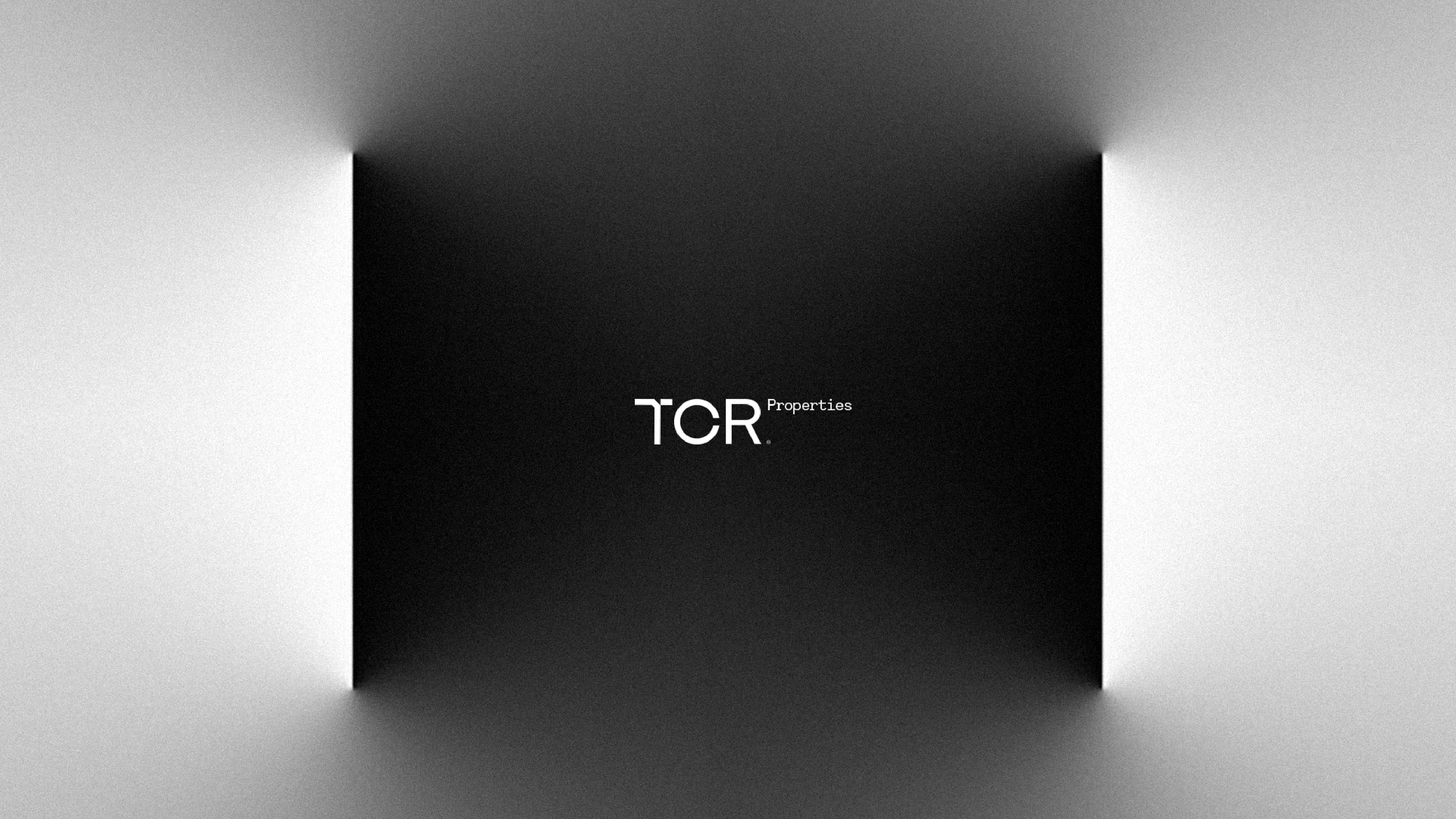 TCR Properties logo on a dark ground